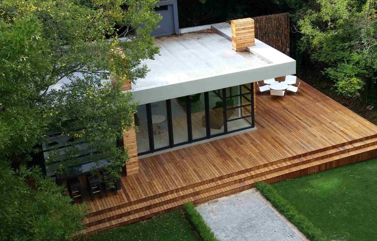 Timber deck surrounding a covered outdoor entertainment area overlooking the garden