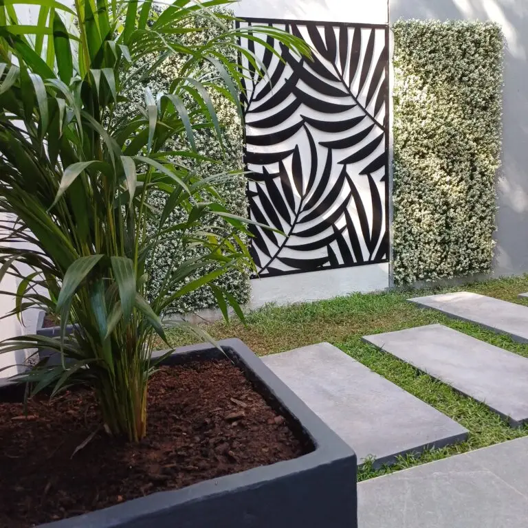 Courtyard garden with large stepping stones, decorative gravel and architectural planting
